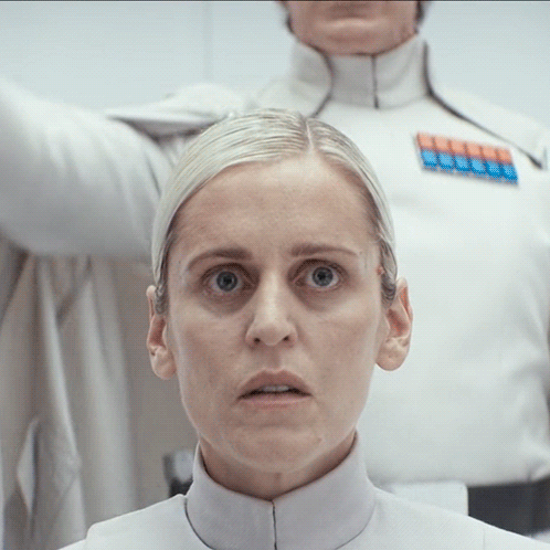 Close Up Of Woman's Face With Man In Background GIF
