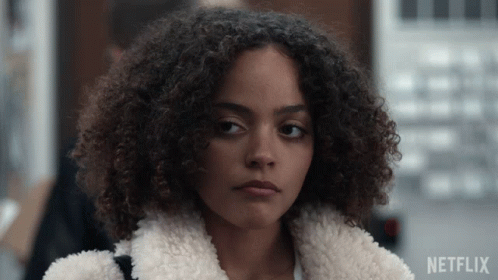 Close Up Of Woman With Netflix Logo Behind GIF