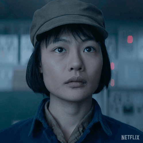 A Close Up Of A Woman 'S Face With A Netflix Logo In The Corner GIF