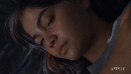 A Close Up Of A Woman 'S Face With A Netflix Logo In The Corner GIF