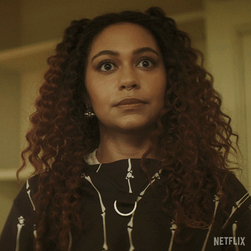 A Close Up Of A Woman 'S Face With A Netflix Logo In The Corner GIF