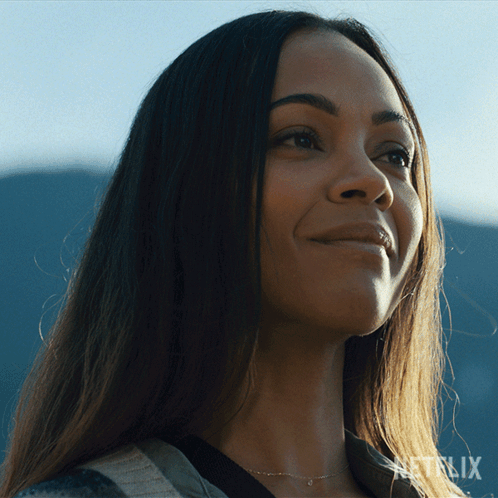 A Close Up Of A Woman 'S Face With A Netflix Logo In The Corner GIF