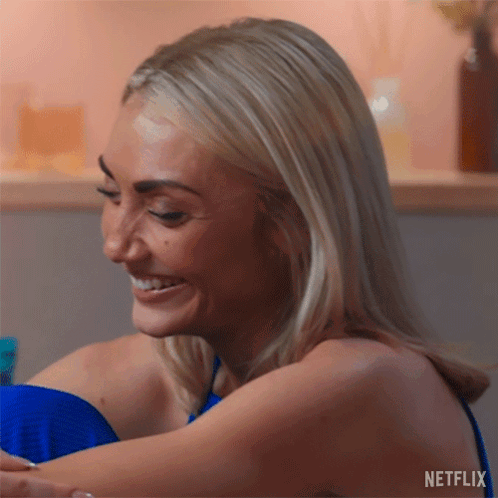 A Close Up Of A Woman 'S Face With A Netflix Logo In The Corner GIF