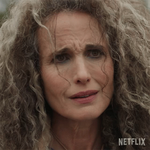 A Close Up Of A Woman 'S Face With A Netflix Logo On The Bottom GIF