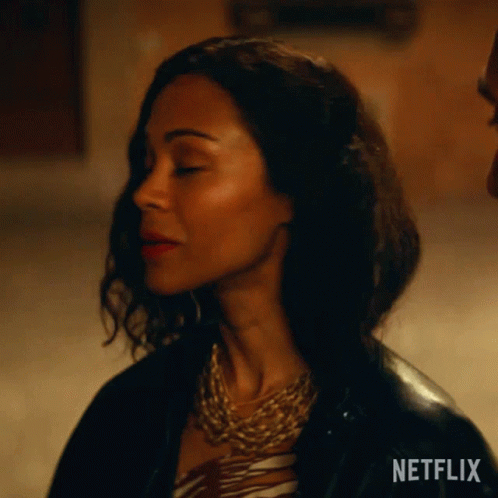A Close Up Of A Woman 'S Face With A Netflix Logo On The Bottom GIF