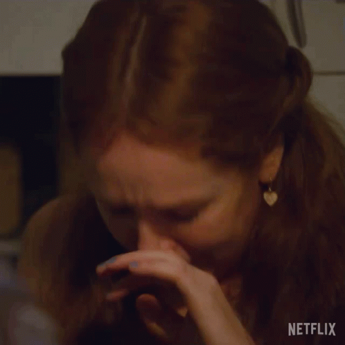 a close up of a woman 's face with a netflix logo visible
