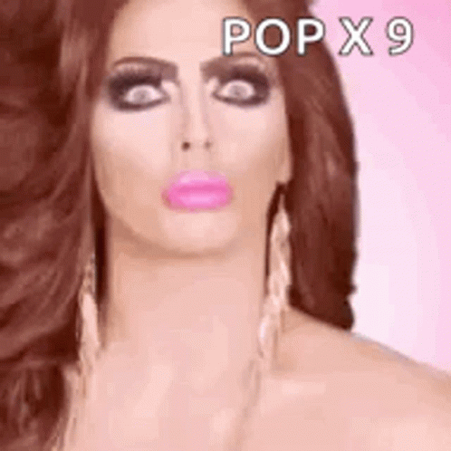 A Close Up Of A Woman 'S Face With A Pink Lip . GIF