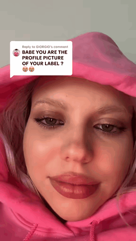 a close up of a woman 's face with a reply to giorgio 's comment below it