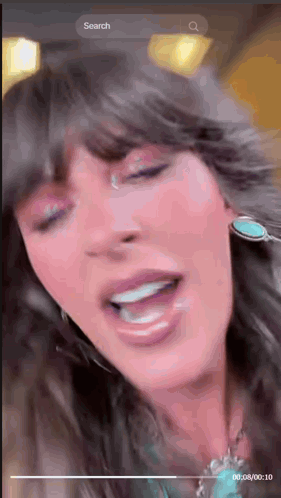 A Close Up Of A Woman 'S Face With A Search Bar At The Bottom GIF