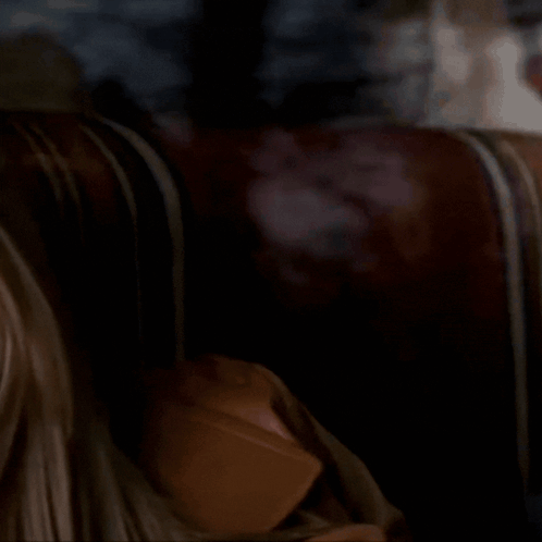 A Close Up Of A Woman 'S Face With A Serious Expression GIF