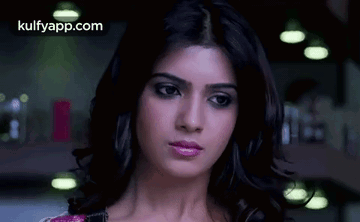A Close Up Of A Woman 'S Face With A Serious Expression . GIF