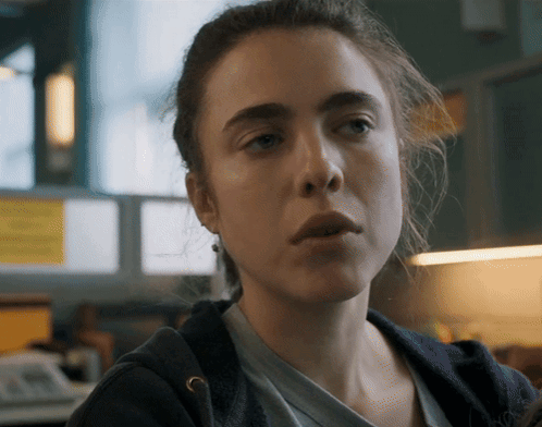 A Close Up Of A Woman 'S Face With A Serious Expression GIF