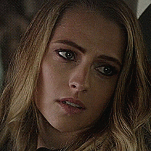 A Close Up Of A Woman 'S Face With A Serious Expression GIF