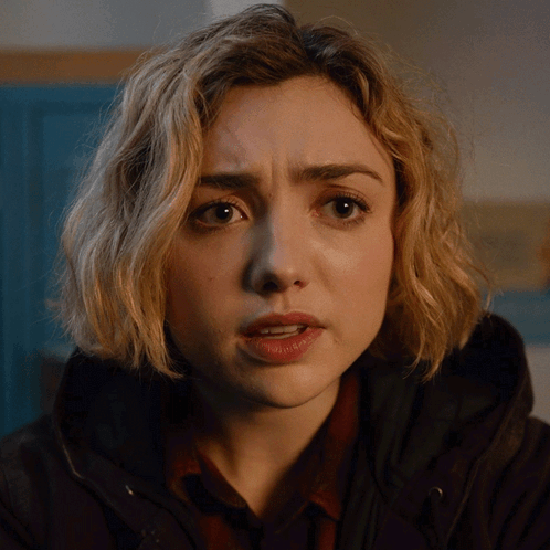 A Close Up Of A Woman 'S Face With A Serious Expression GIF