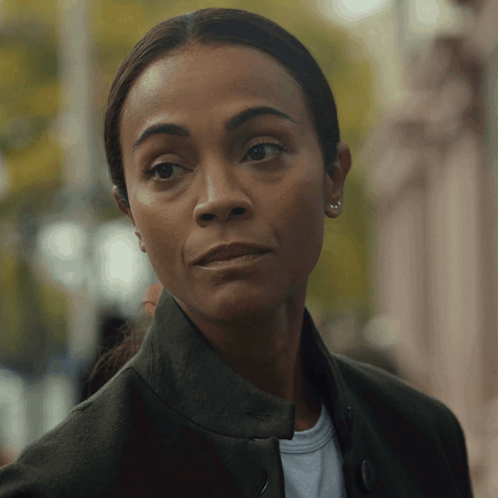A Close Up Of A Woman 'S Face With A Serious Look GIF