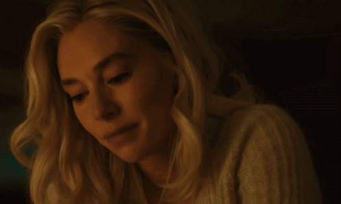 A Close Up Of A Woman 'S Face With A Serious Look On Her Face GIF