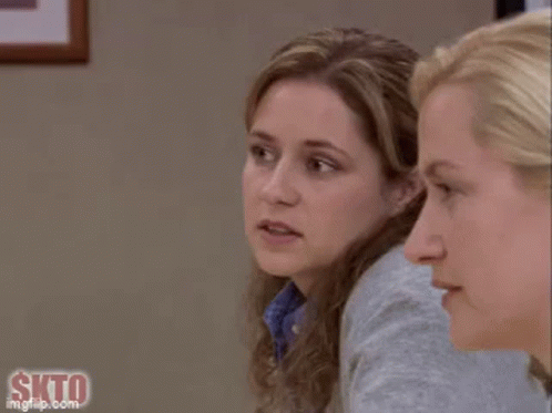 A Close Up Of A Woman 'S Face With A Slight Smile On Her Face . GIF