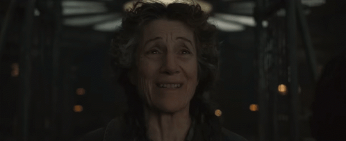 A Close Up Of A Woman 'S Face With A Smile On Her Face . GIF