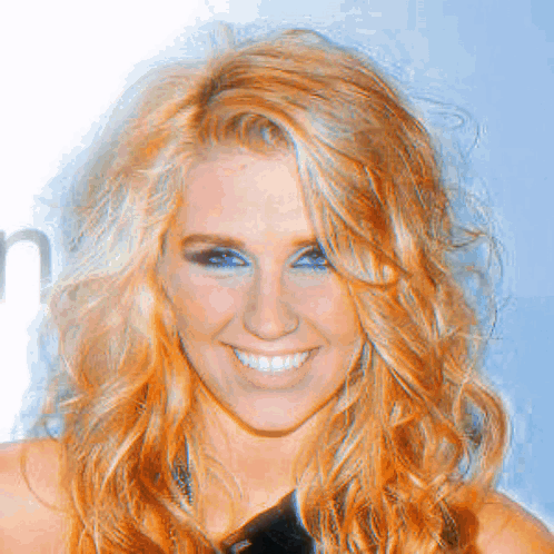 A Close Up Of A Woman 'S Face With A Smile On Her Face GIF