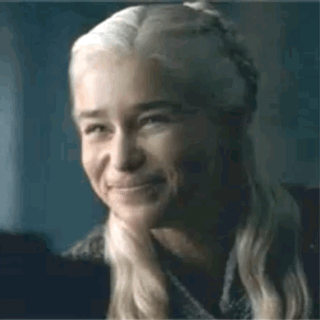 A Close Up Of A Woman 'S Face With A Smile On It . GIF