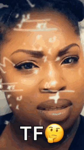 A Close Up Of A Woman 'S Face With A Smiley Face And The Words Tf Written On It GIF
