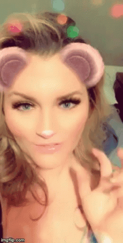 A Close Up Of A Woman 'S Face With A Snapchat Filter On It GIF