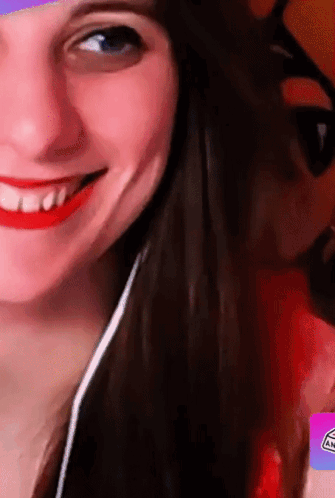 A Close Up Of A Woman 'S Face With A Sticker That Says An GIF