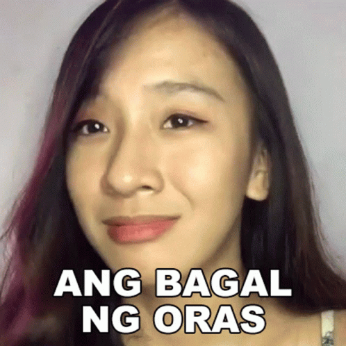 a close up of a woman 's face with a sticker that says ang bagai ng oras .