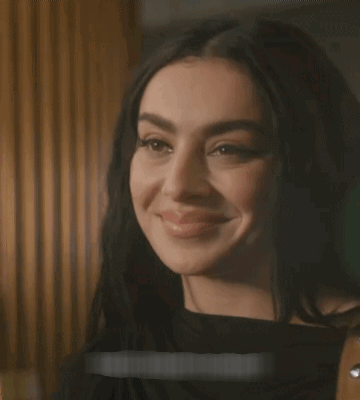 A Close Up Of A Woman 'S Face With A Sticker That Says ' I 'M Sorry ' On It GIF