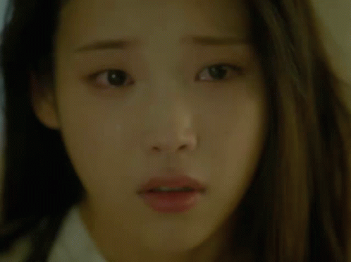A Close Up Of A Woman 'S Face With A Surprised Expression GIF