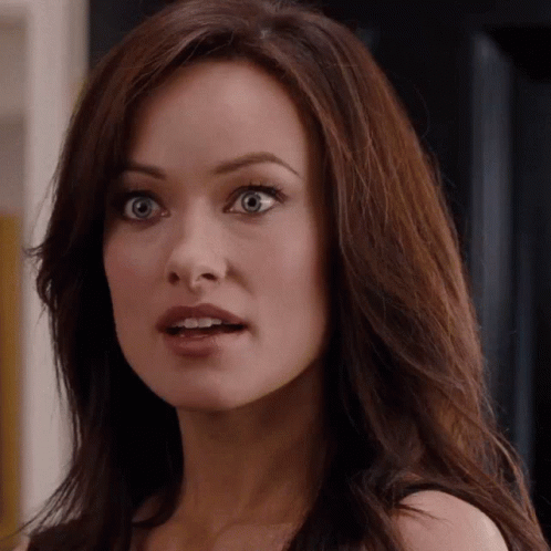 A Close Up Of A Woman 'S Face With A Surprised Expression GIF