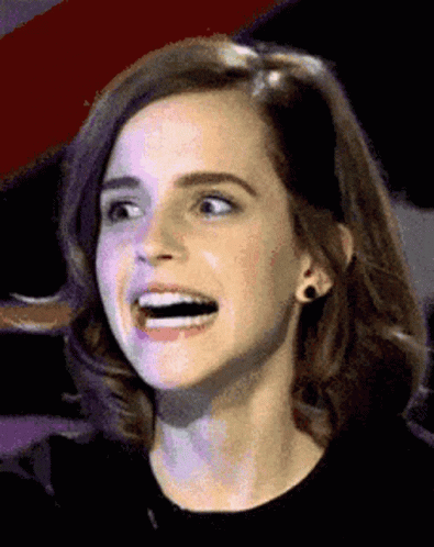 A Close Up Of A Woman 'S Face With A Surprised Look On Her Face GIF