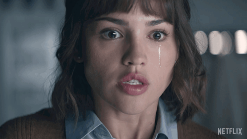 A Close Up Of A Woman 'S Face With A Tear Coming Out Of Her Eye And The Words Netflix On The Bottom GIF