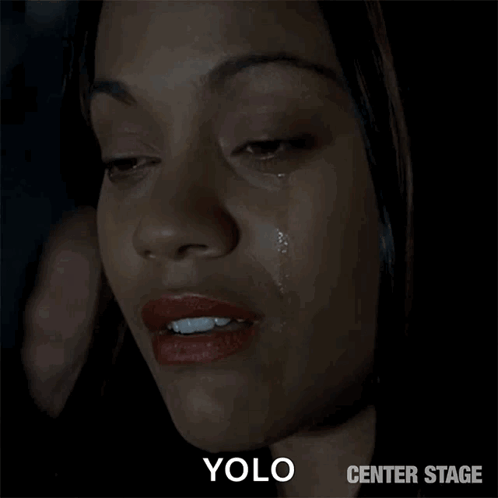 A Close Up Of A Woman 'S Face With A Tear Coming Out Of Her Eye And The Words Yolo Center Stage Below It GIF