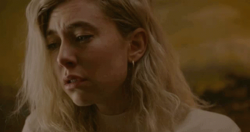 A Close Up Of A Woman 'S Face With A Tear Running Down Her Cheek GIF