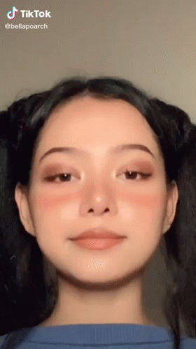 A Close Up Of A Woman 'S Face With A Tik Tok Watermark GIF