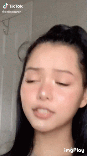 A Close Up Of A Woman 'S Face With A Tik Tok Watermark GIF