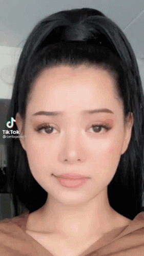 A Close Up Of A Woman 'S Face With A Tiktok Watermark GIF