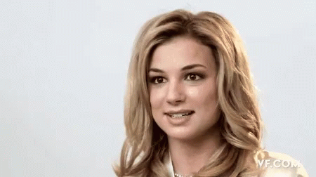 A Close Up Of A Woman 'S Face With A Vf.com Logo In The Corner GIF