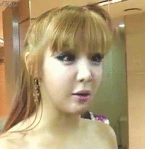 A Close Up Of A Woman 'S Face With A Watermark That Says ' J.m.p. ' GIF