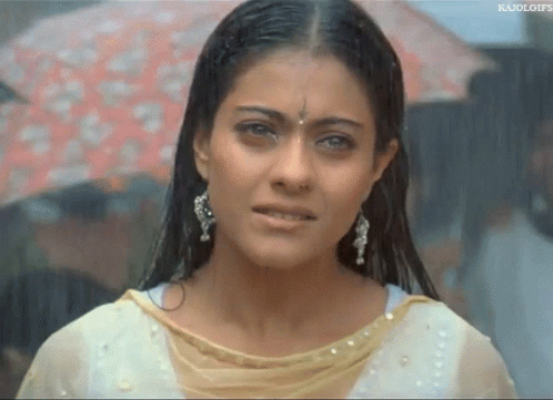 A Close Up Of A Woman 'S Face With A Watermark That Says ' Kajol Gifs ' On It GIF