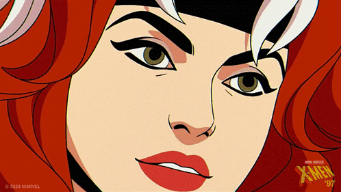 A Close Up Of A Woman 'S Face With A X-Men Logo In The Corner GIF