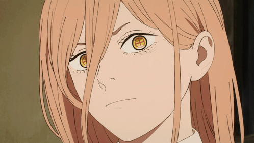 A Close Up Of A Woman 'S Face With A Yellow Eye GIF