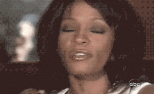 A Close Up Of A Woman 'S Face With Abc Written On The Bottom GIF