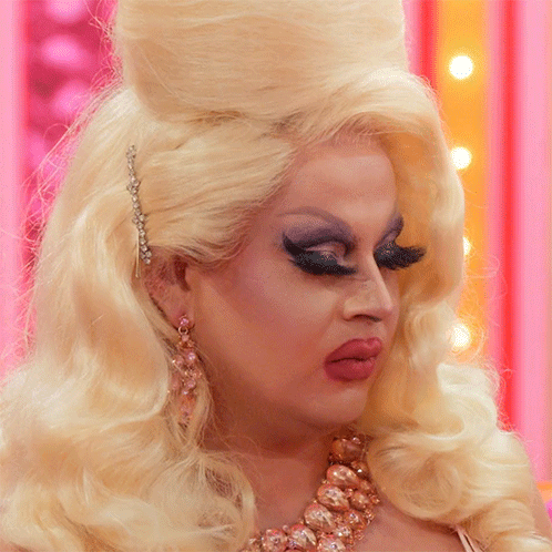 Close Up Of Woman's Face With Blonde Hair And Necklace GIF