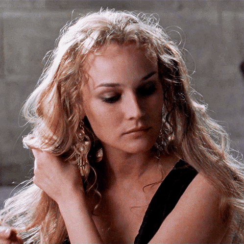 A Close Up Of A Woman 'S Face With Blonde Hair GIF