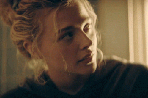 A Close Up Of A Woman 'S Face With Blonde Hair GIF