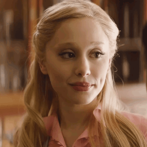 A Close Up Of A Woman 'S Face With Blonde Hair GIF