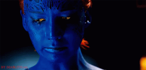 A Close Up Of A Woman 'S Face With Blue Paint On It And A Tear Running Down Her Face . GIF