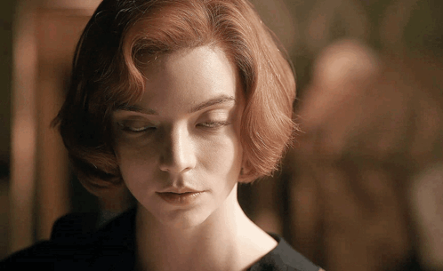 A Close Up Of A Woman 'S Face With Closed Eyes GIF